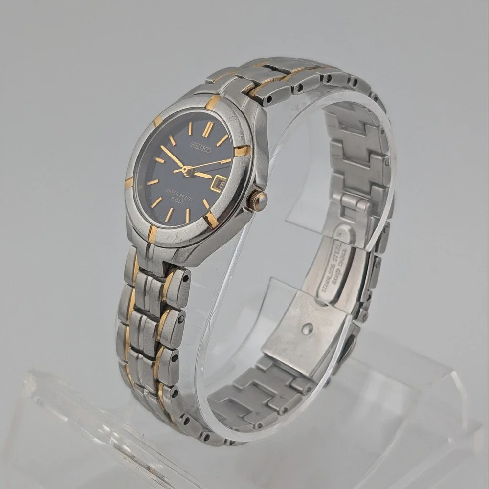 Seiko 7N82-0AG0 Blue Sunburst Two Tone Date Quartz Watch 50M‎